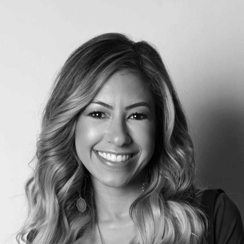 Portrait of Christine, a professional stylist at [salon] 718, showcasing their expertise and style.