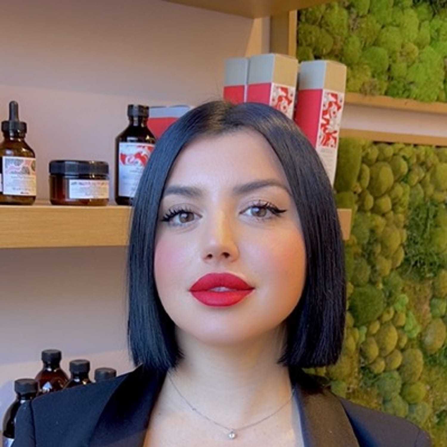 Portrait of Giulia, a professional stylist at [salon] 718, showcasing their expertise and style.