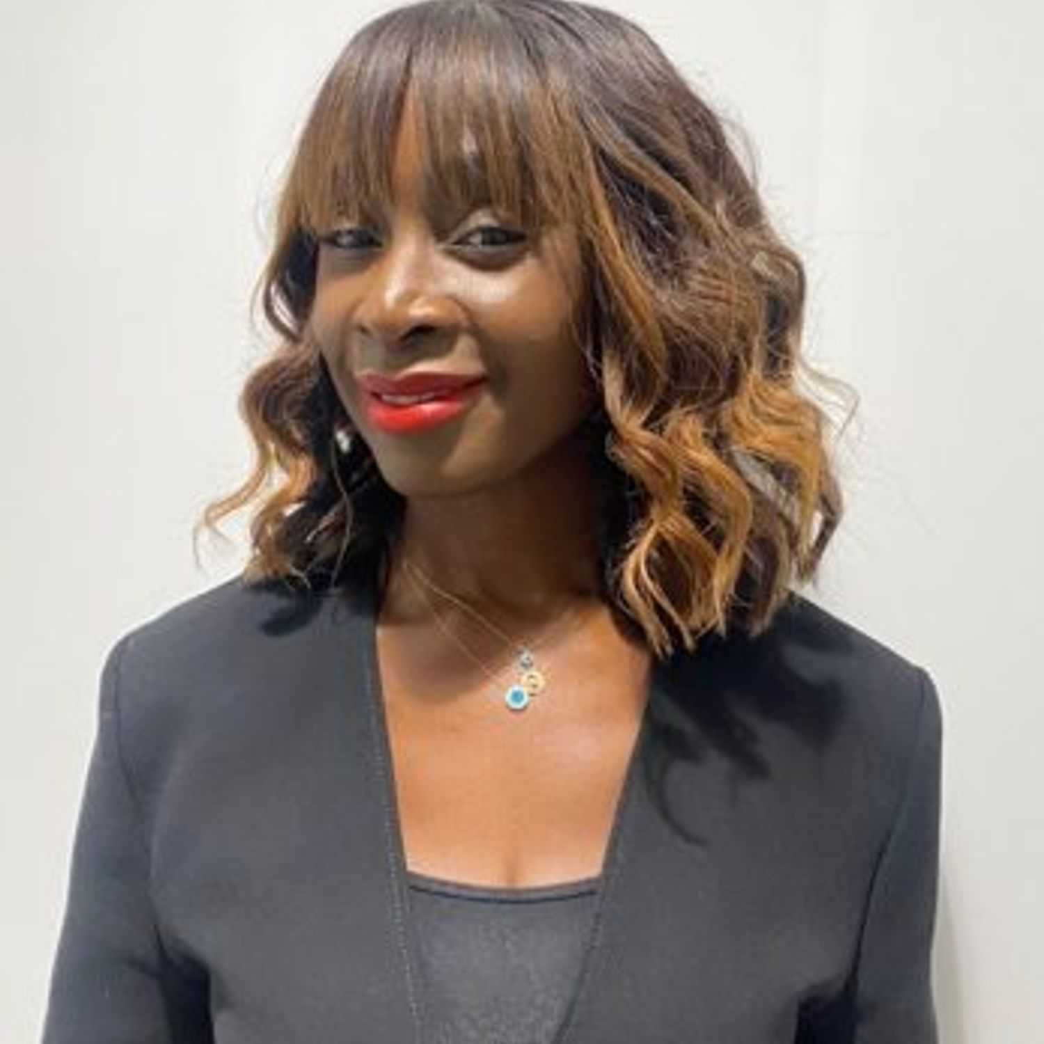 Portrait of Annmarie, a professional stylist at [salon] 718, showcasing their expertise and style.