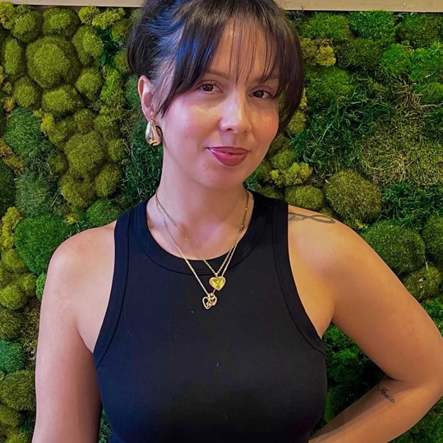 Portrait of Martha, a professional stylist at [salon] 718, showcasing their expertise and style.