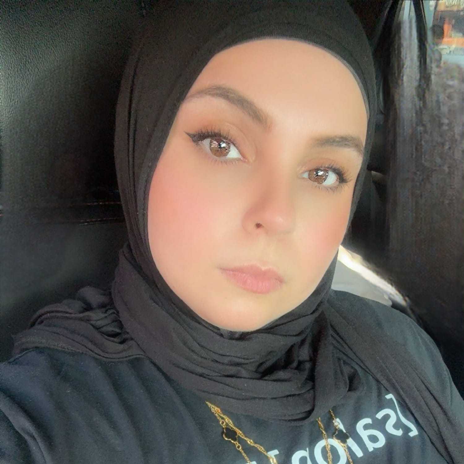 Portrait of Marwa, a professional stylist at [salon] 718, showcasing their expertise and style.