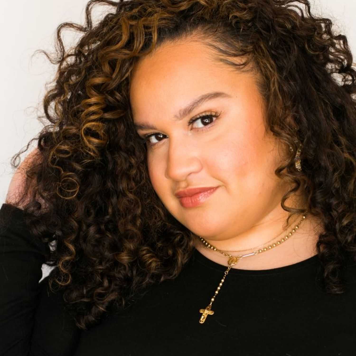 Portrait of Ello, a professional stylist at [salon] 718, showcasing their expertise and style.