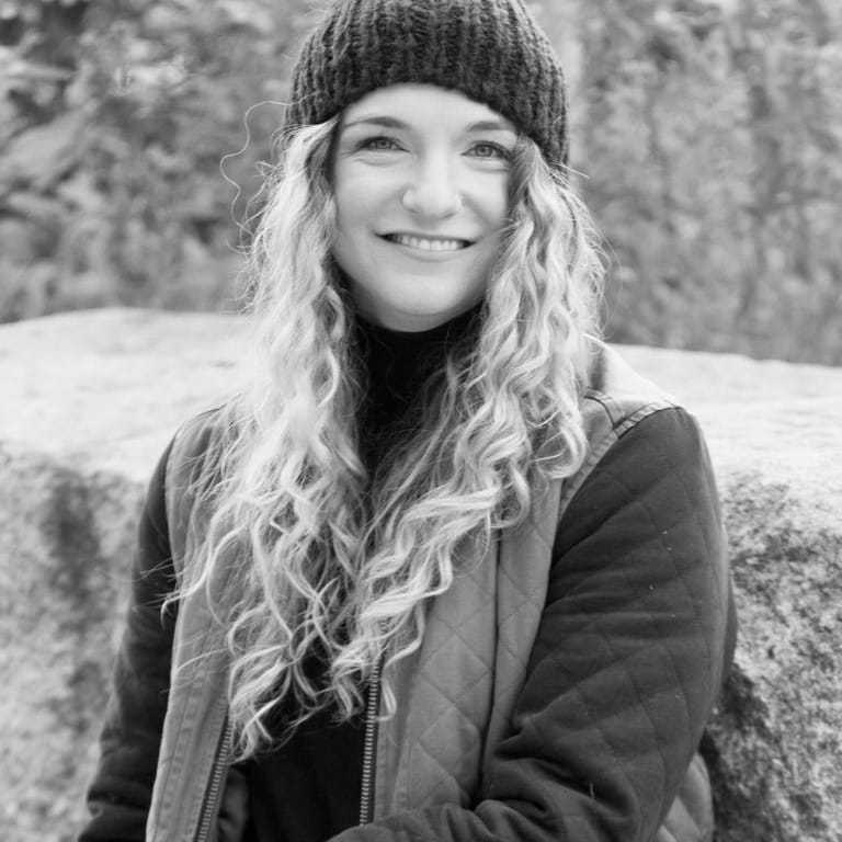 Portrait of Sarah, a professional stylist at [salon] 718, showcasing their expertise and style.