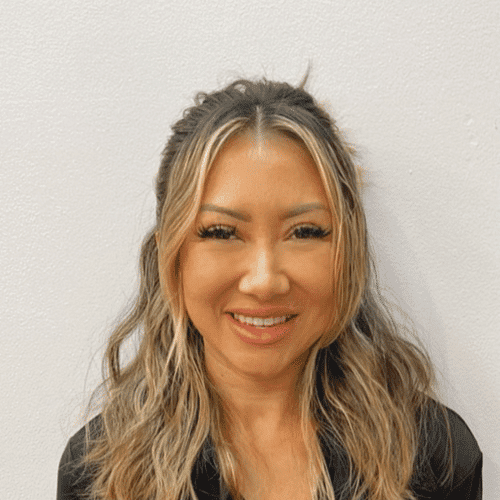 Portrait of Sachi, a professional stylist at [salon] 718, showcasing their expertise and style.