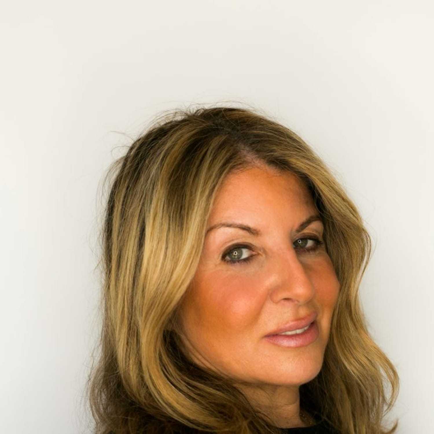 Portrait of Jovi, a professional stylist at [salon] 718, showcasing their expertise and style.