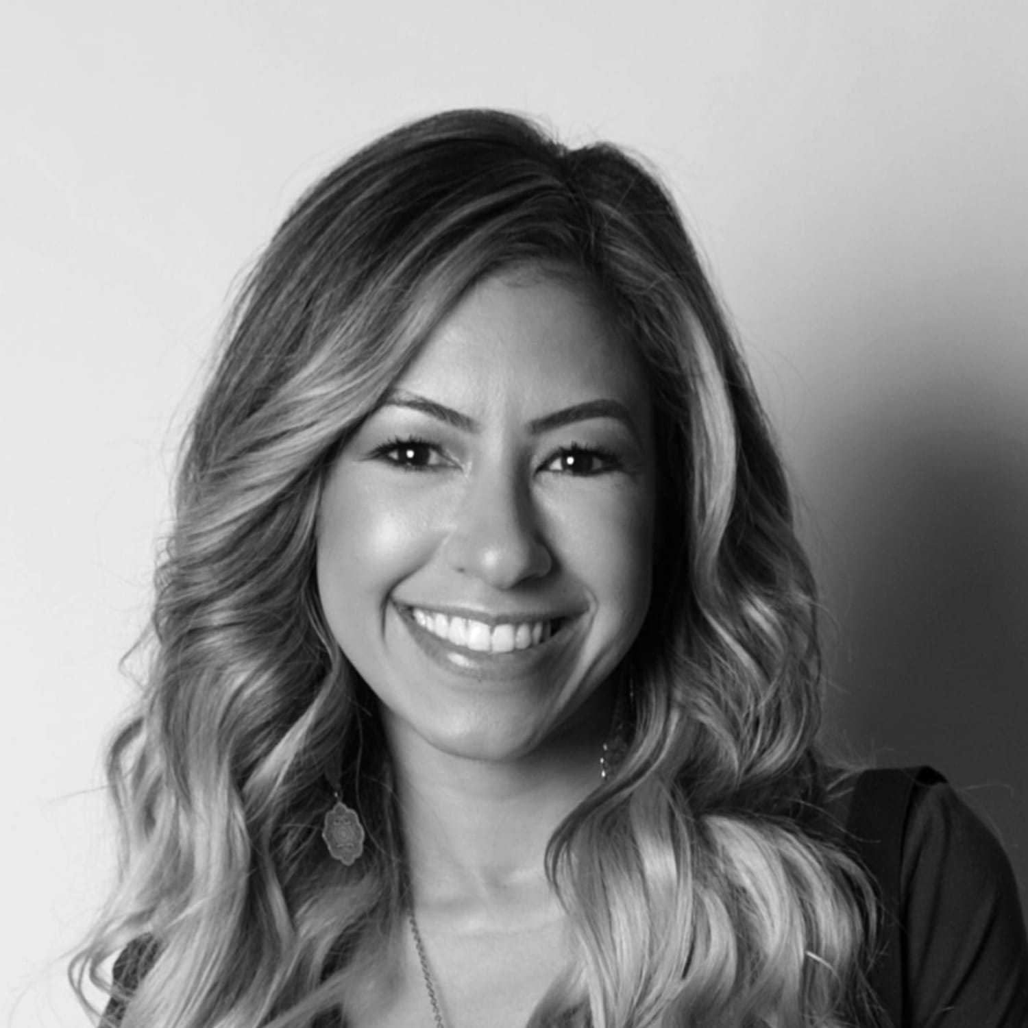 Portrait of Christine, a professional stylist at [salon] 718, showcasing their expertise and style.