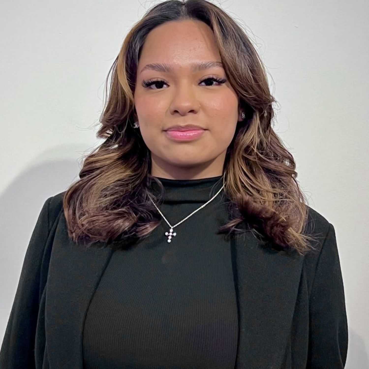 Portrait of Karen, a professional stylist at [salon] 718, showcasing their expertise and style.