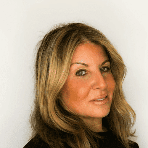 Portrait of Jovi, a professional stylist at [salon] 718, showcasing their expertise and style.