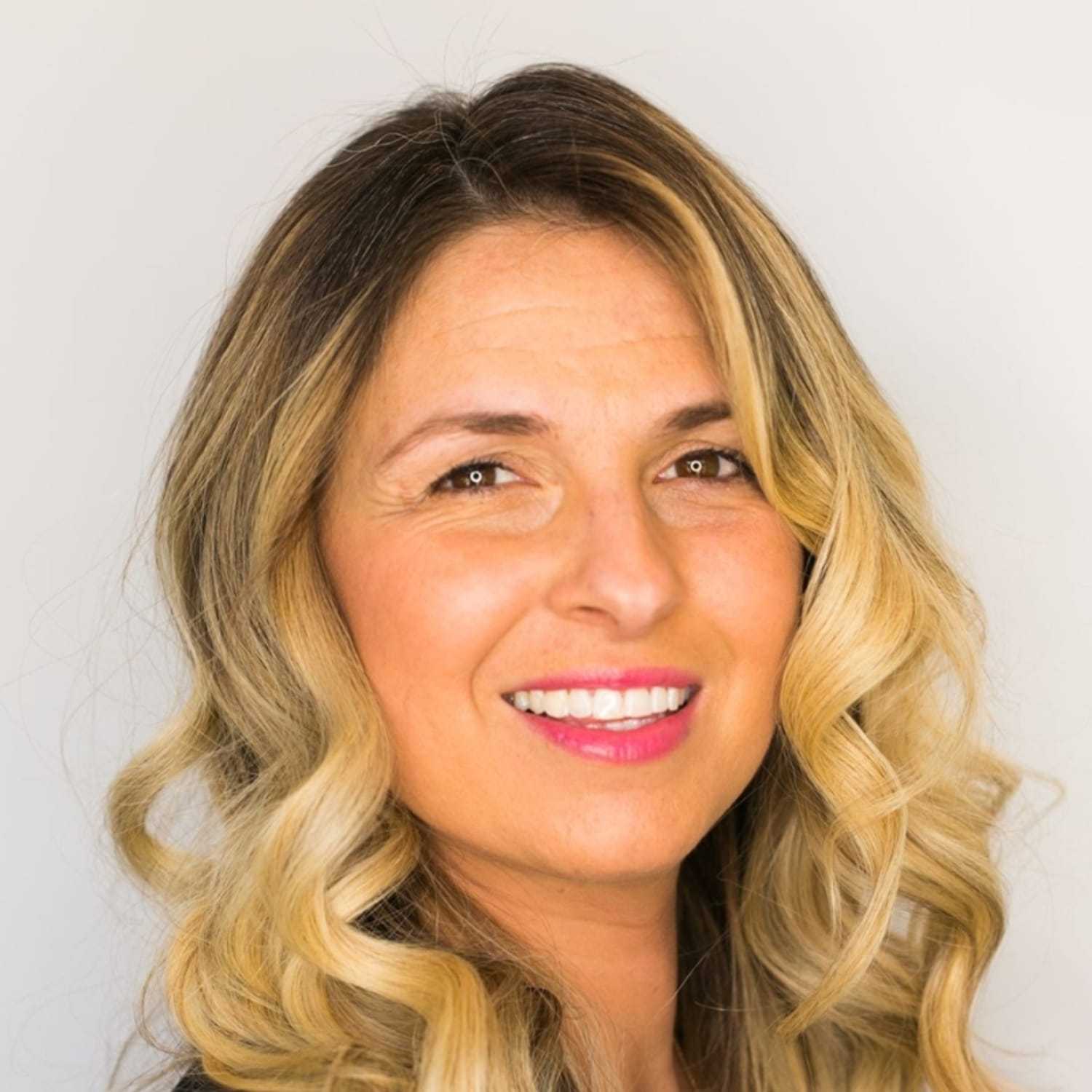 Portrait of Stephanie, a professional stylist at [salon] 718, showcasing their expertise and style.