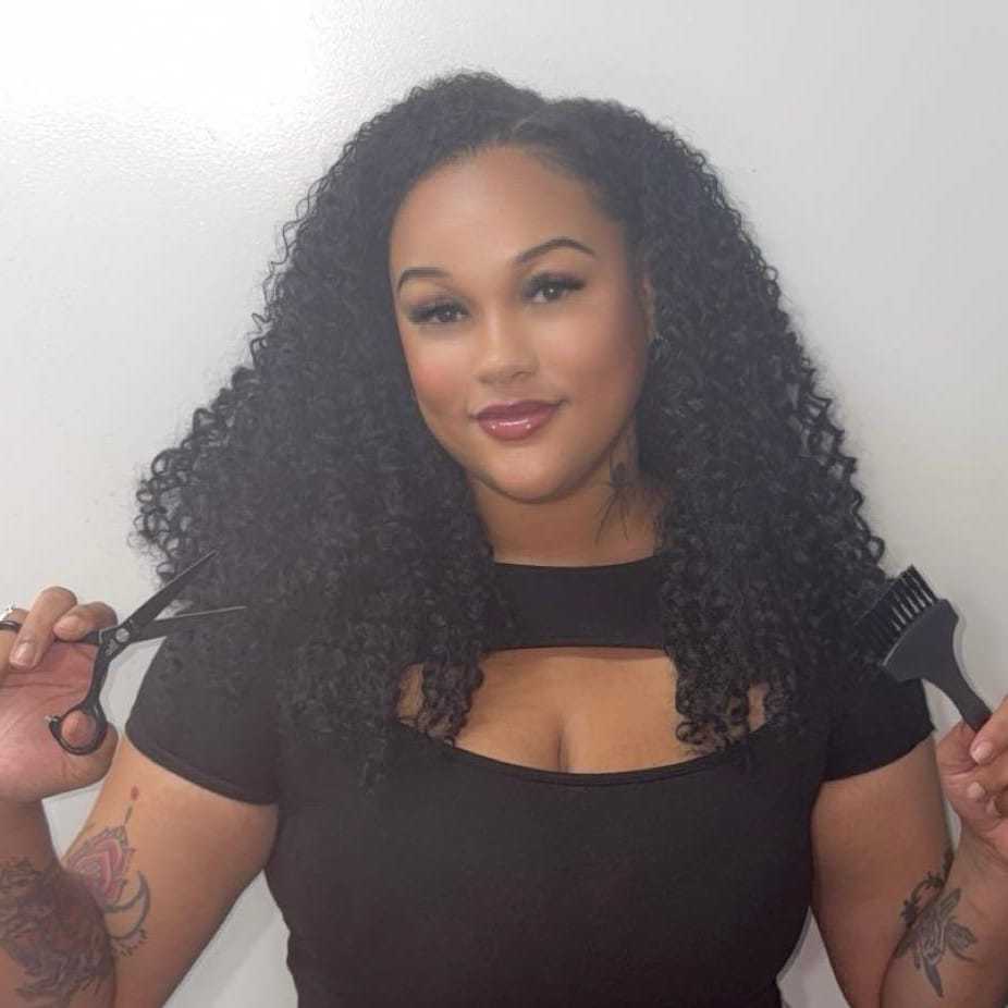 Portrait of Talya, a professional stylist at [salon] 718, showcasing their expertise and style.