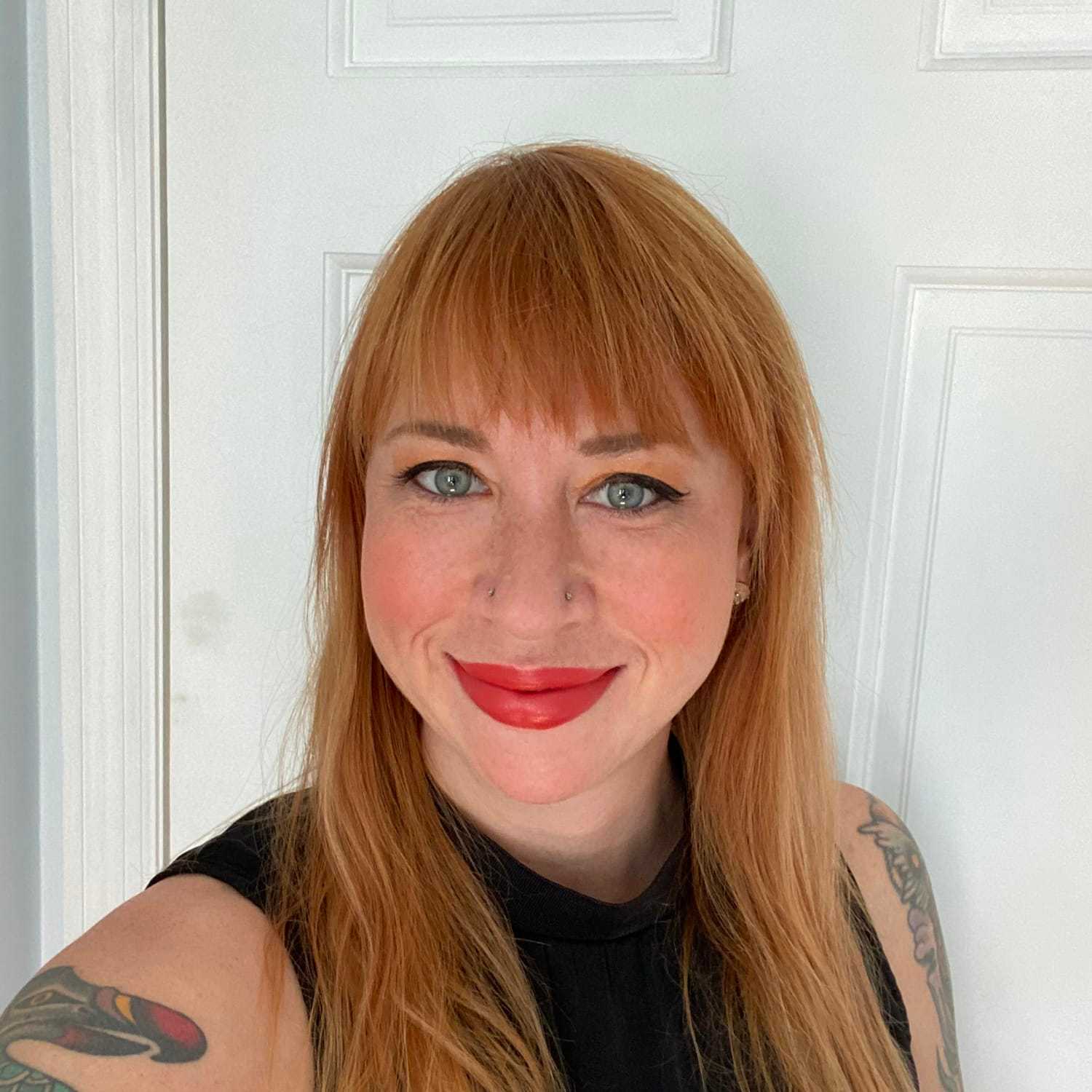 Portrait of Natasha, a professional stylist at [salon] 718, showcasing their expertise and style.