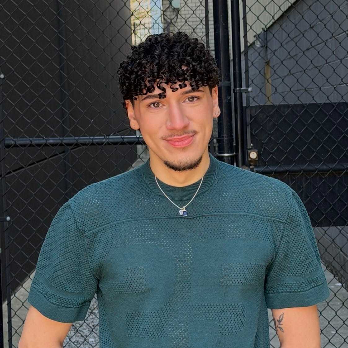 Portrait of Brandon, a professional stylist at [salon] 718, showcasing their expertise and style.