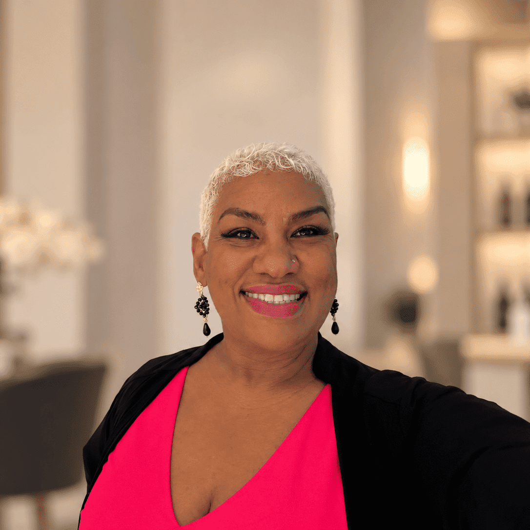 Portrait of Marci, a professional stylist at [salon] 718, showcasing their expertise and style.