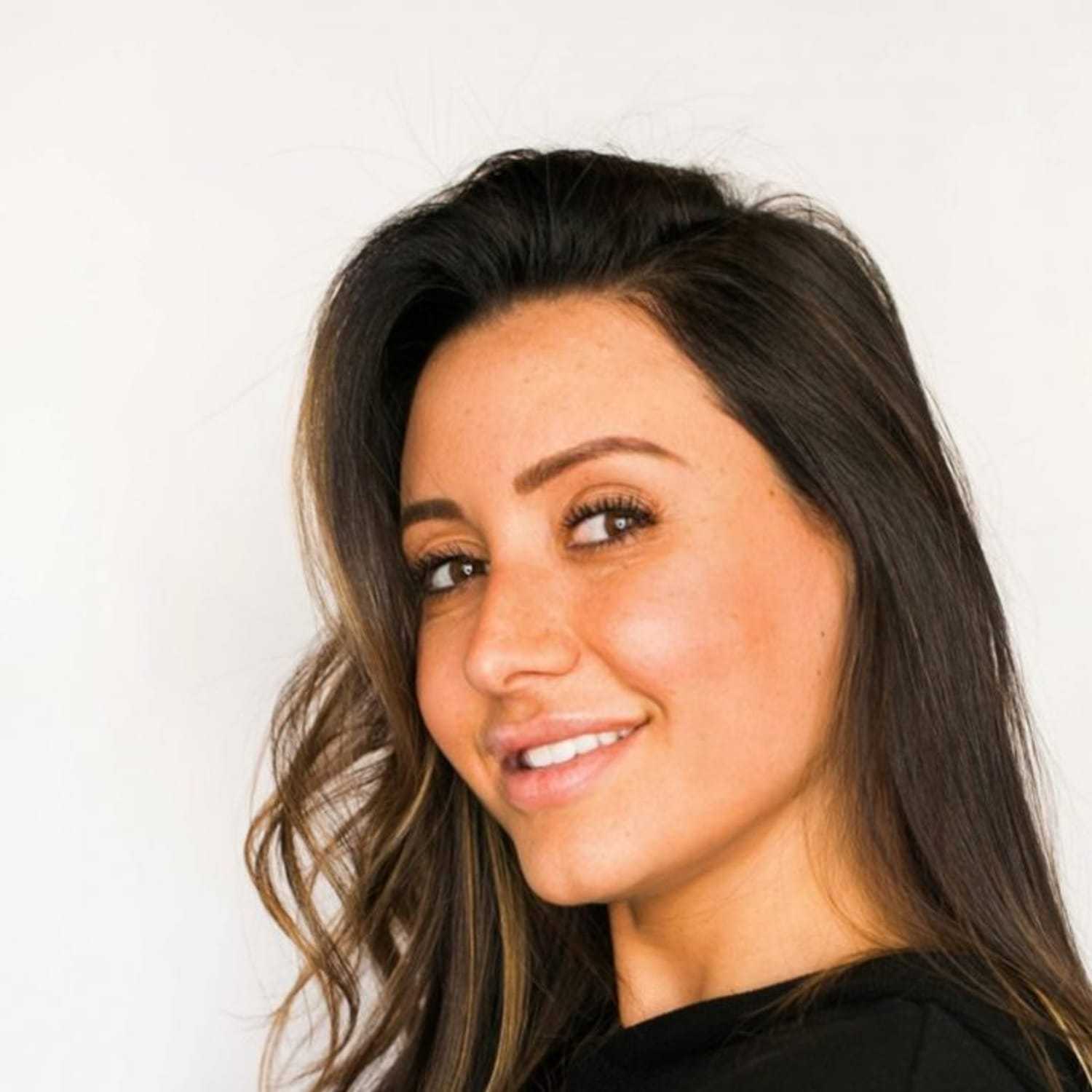 Portrait of Jay, a professional stylist at [salon] 718, showcasing their expertise and style.