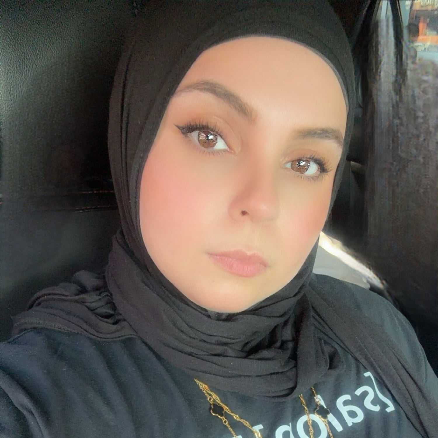 Portrait of Marwa, a professional stylist at [salon] 718, showcasing their expertise and style.