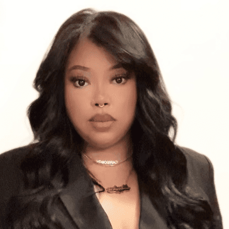 Portrait of Marlene, a professional stylist at [salon] 718, showcasing their expertise and style.