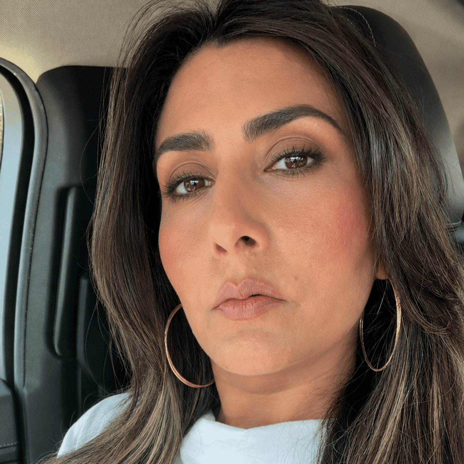 Portrait of Fariha, a professional stylist at [salon] 718, showcasing their expertise and style.