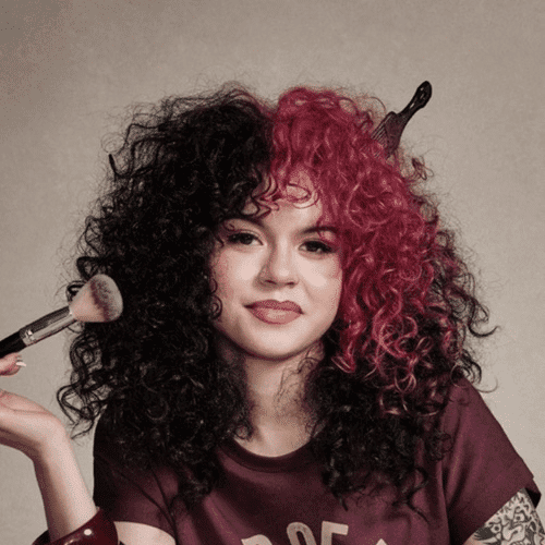 Portrait of Sophie, a professional stylist at [salon] 718, showcasing their expertise and style.