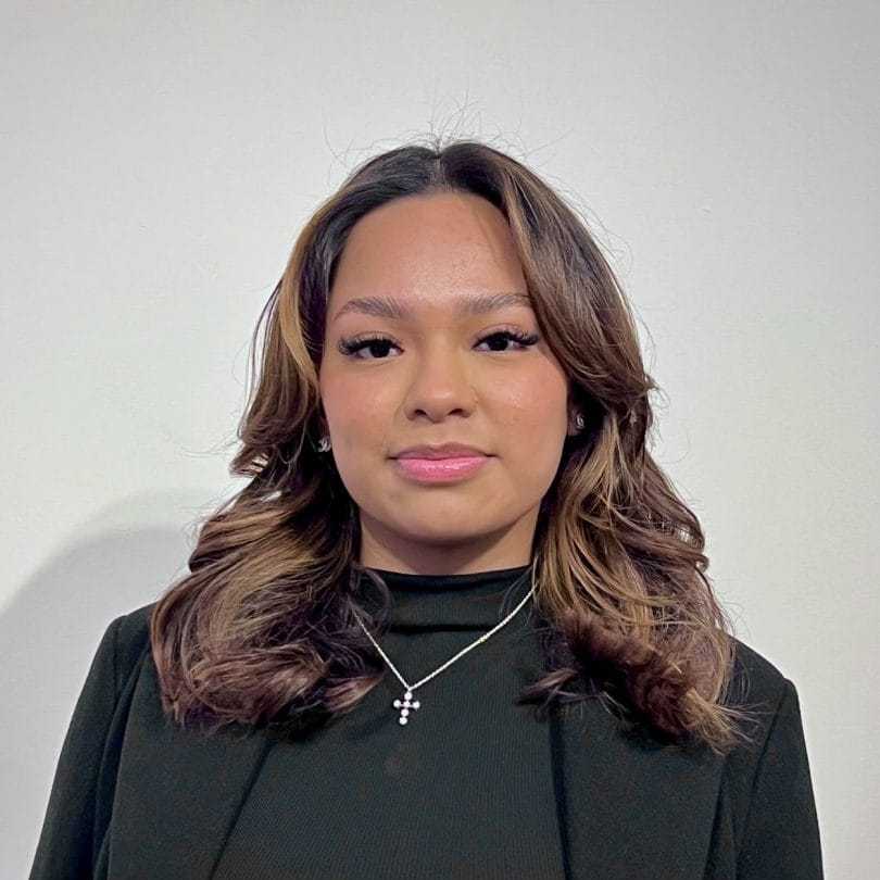 Portrait of Karen, a professional stylist at [salon] 718, showcasing their expertise and style.