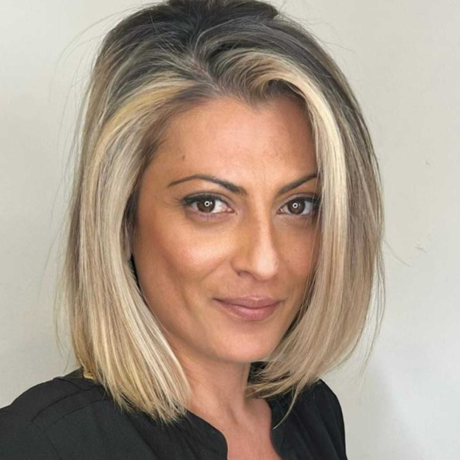 Portrait of Irene, a professional stylist at [salon] 718, showcasing their expertise and style.