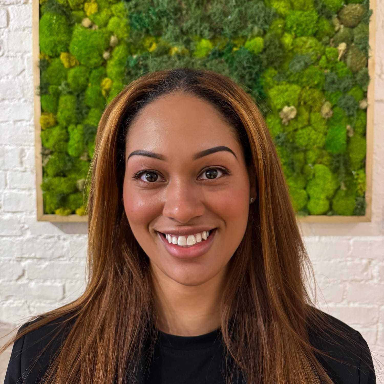 Portrait of Stefy, a professional stylist at [salon] 718, showcasing their expertise and style.