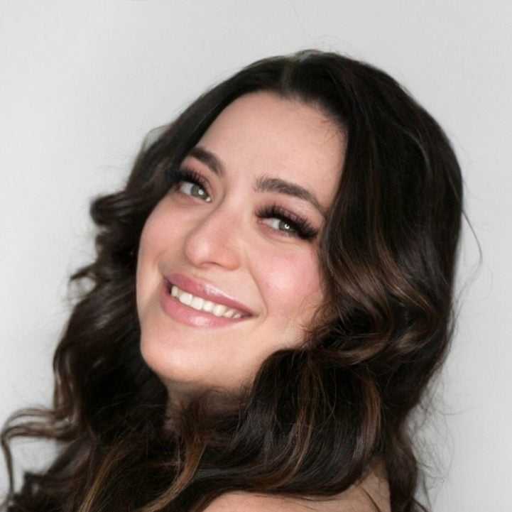 Portrait of Janelle, a professional stylist at [salon] 718, showcasing their expertise and style.