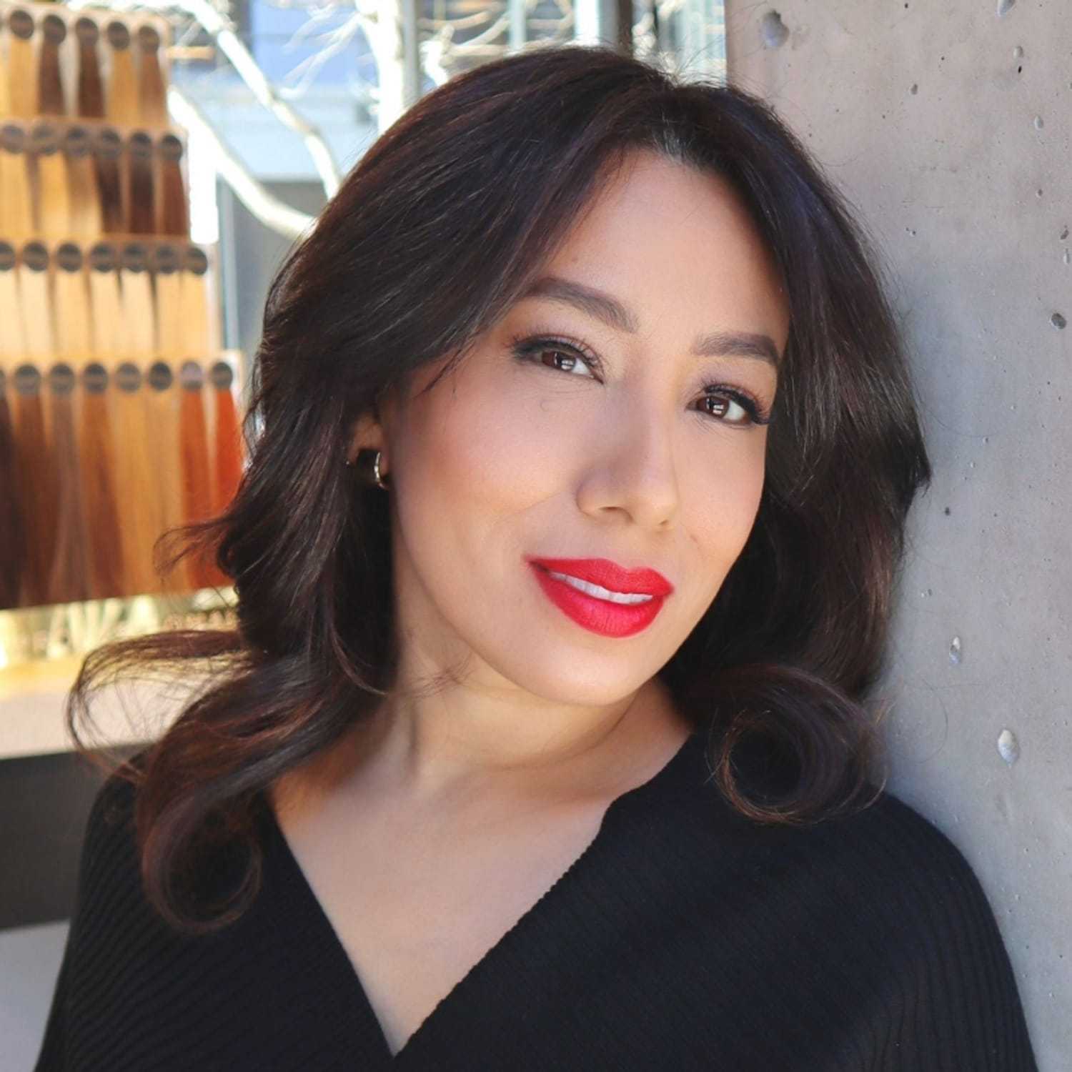 Portrait of Mercedes, a professional stylist at [salon] 718, showcasing their expertise and style.