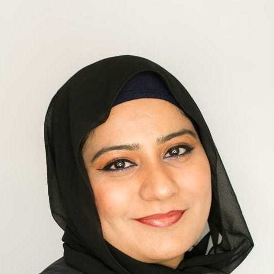 Portrait of Uzma, a professional stylist at [salon] 718, showcasing their expertise and style.