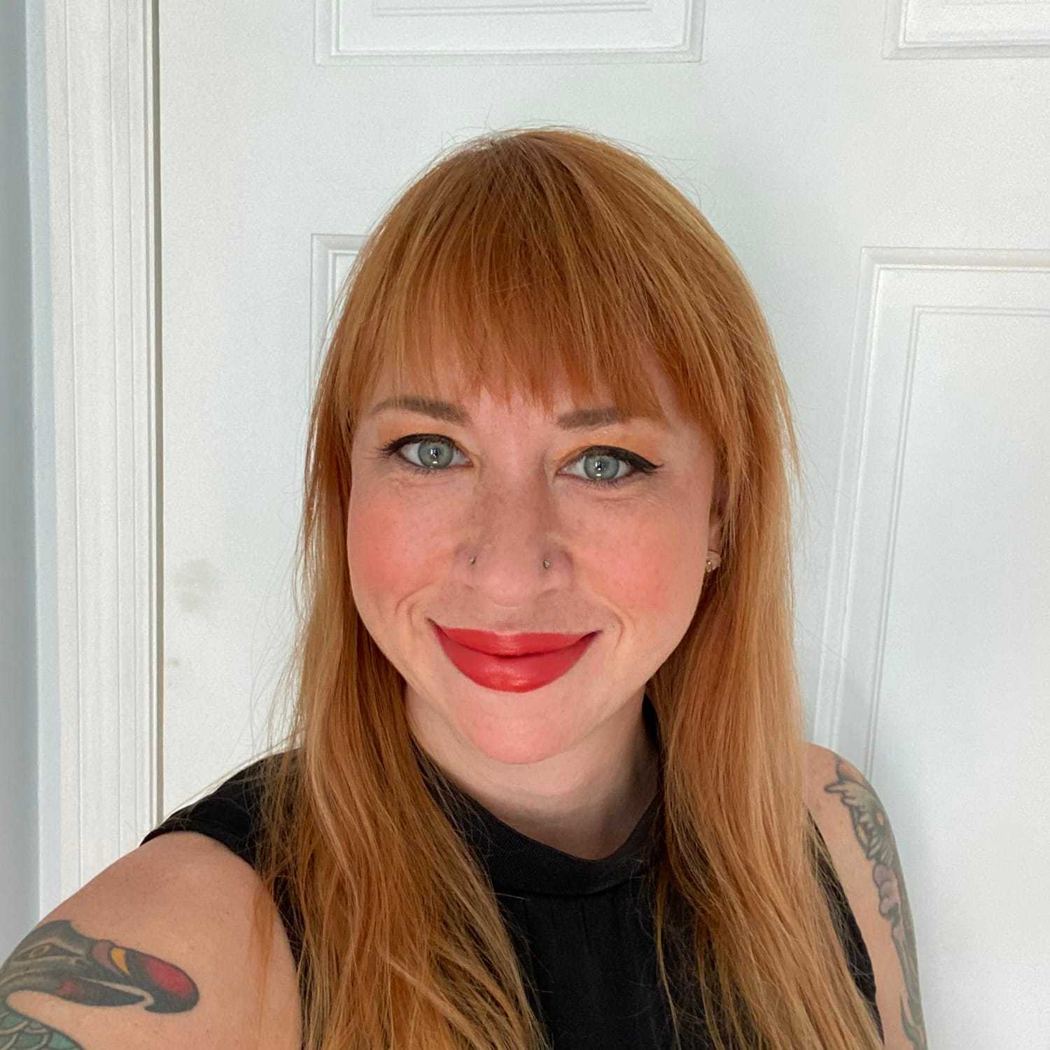 Portrait of Natasha, a professional stylist at [salon] 718, showcasing their expertise and style.