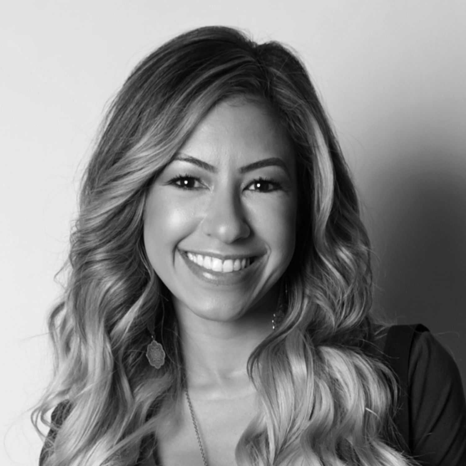 Portrait of Christine, a professional stylist at [salon] 718, showcasing their expertise and style.