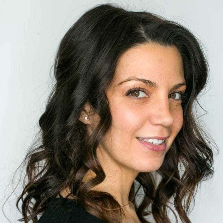 Portrait of Jennifer V, a professional stylist at [salon] 718, showcasing their expertise and style.