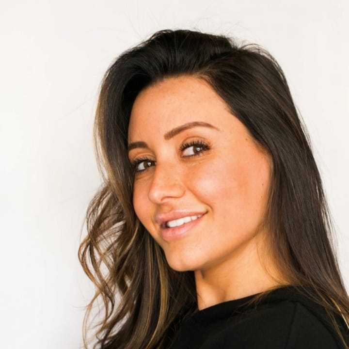Portrait of Jay, a professional stylist at [salon] 718, showcasing their expertise and style.