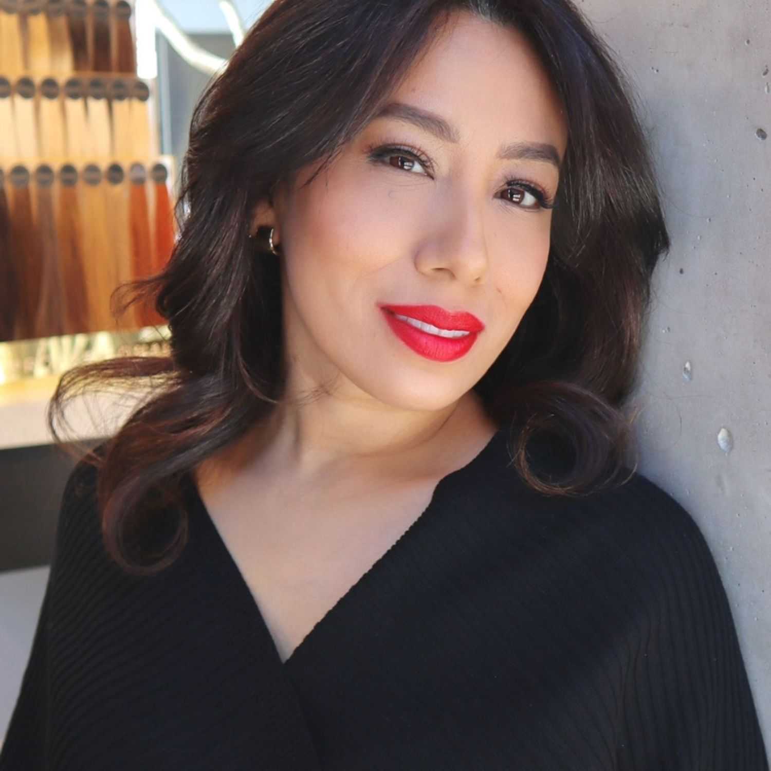 Portrait of Mercedes, a professional stylist at [salon] 718, showcasing their expertise and style.
