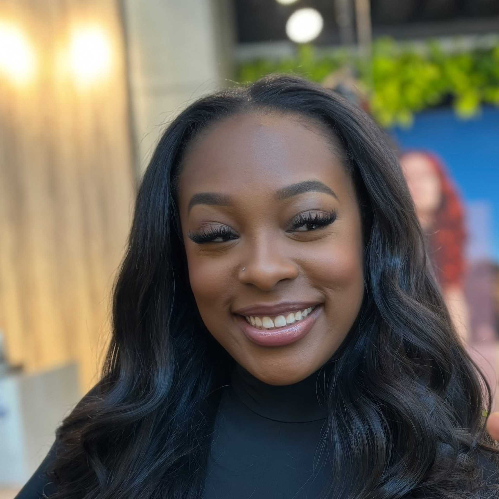 Portrait of Ari, a professional stylist at [salon] 718, showcasing their expertise and style.