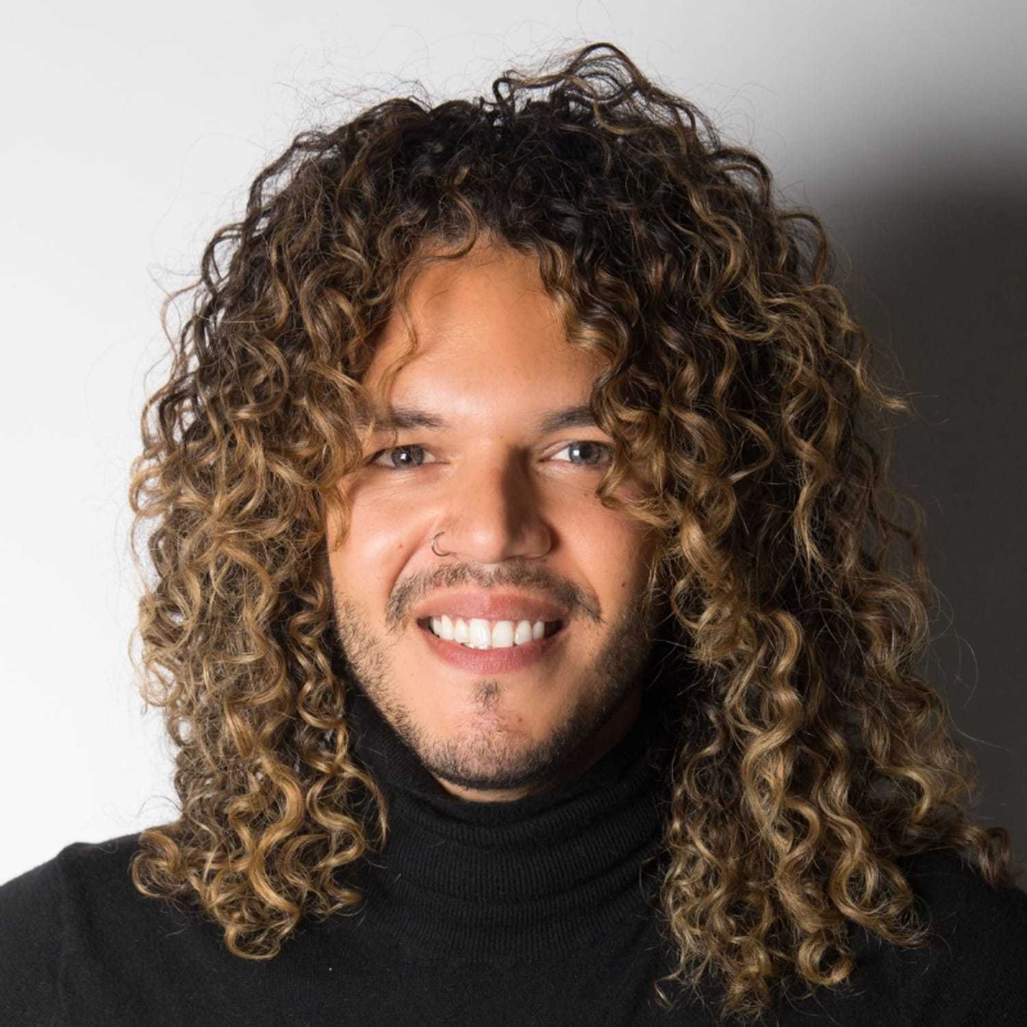 Portrait of Jonathan, a professional stylist at [salon] 718, showcasing their expertise and style.